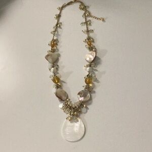Shell and gold stone necklace.